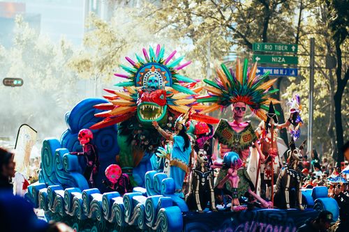Free Vibrant parade float with traditional costumes during Day of the Dead celebration in Mexico City. Stock Photo