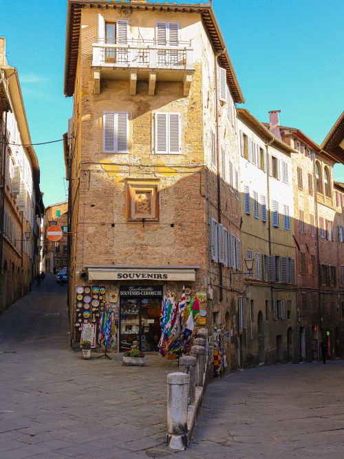Free Explore a picturesque souvenir store nestled in the historic streets of Siena, Italy. Stock Photo