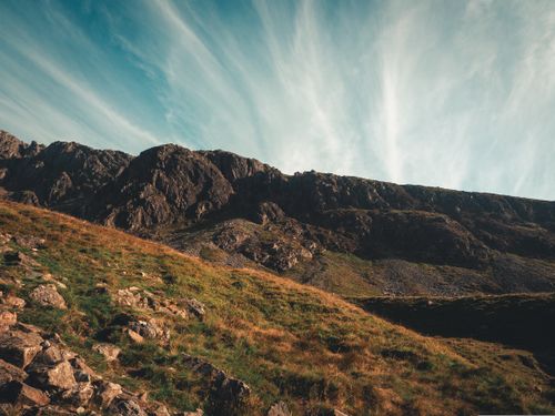 Free Stunning view of a rugged mountain landscape under a dramatic sky, showcasing nature's raw power. Stock Photo