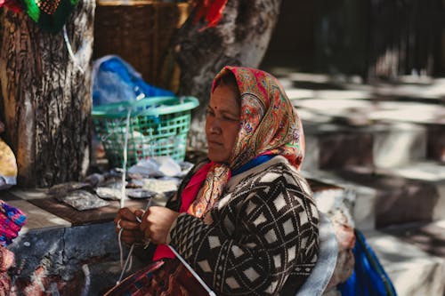 A Woman Knitting Outdoors