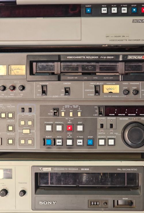 Free Detailed view of retro Betacam and VHS video equipment with buttons and knobs. Stock Photo