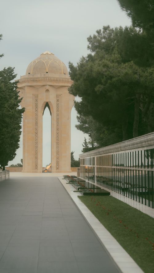 Free Captivating view of the Eternal Flame Memorial in Baku, featuring lush trees and serene pathways. Stock Photo