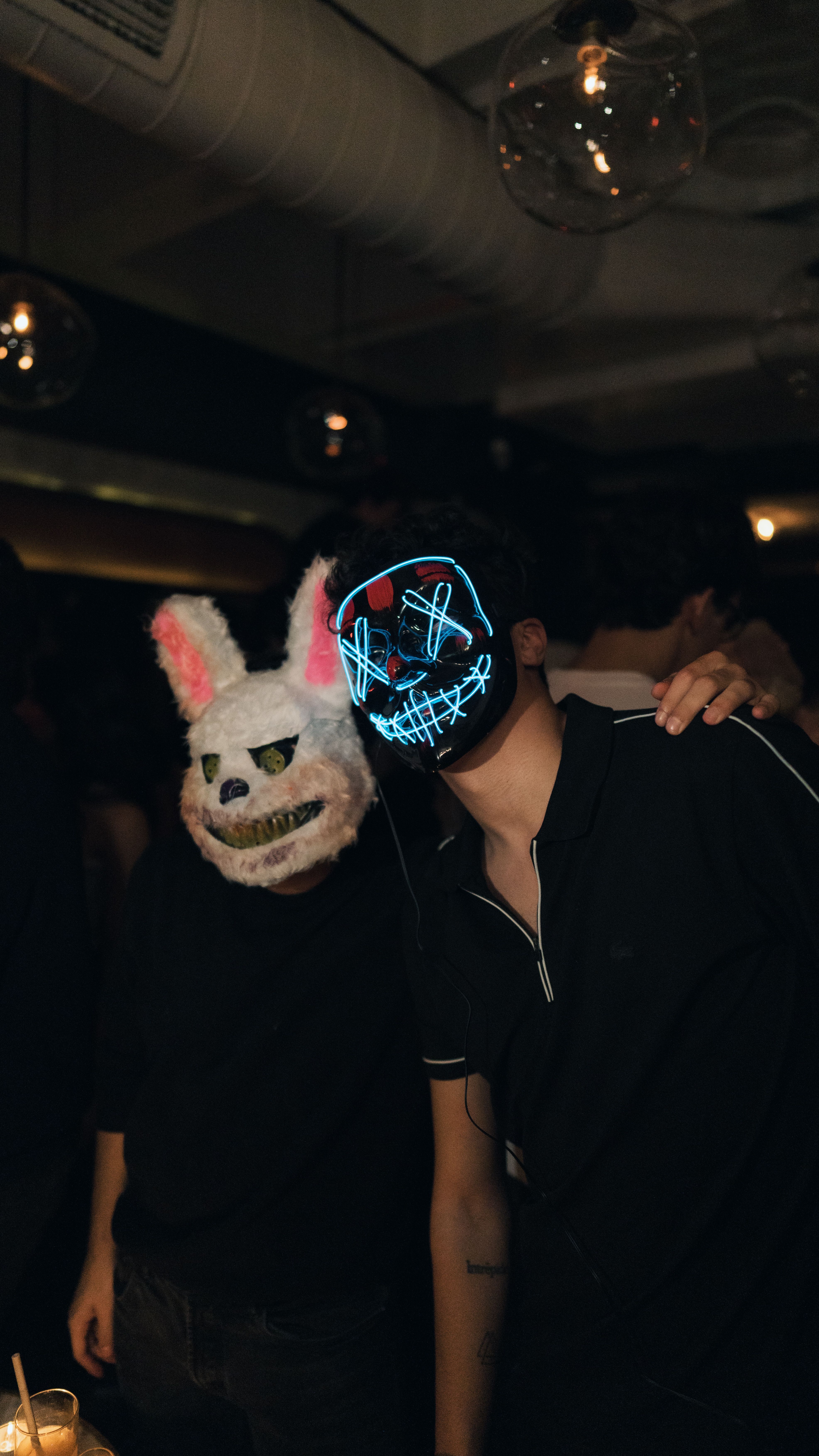 Two Men in Masks at a Party in a Club · Free Stock Photo