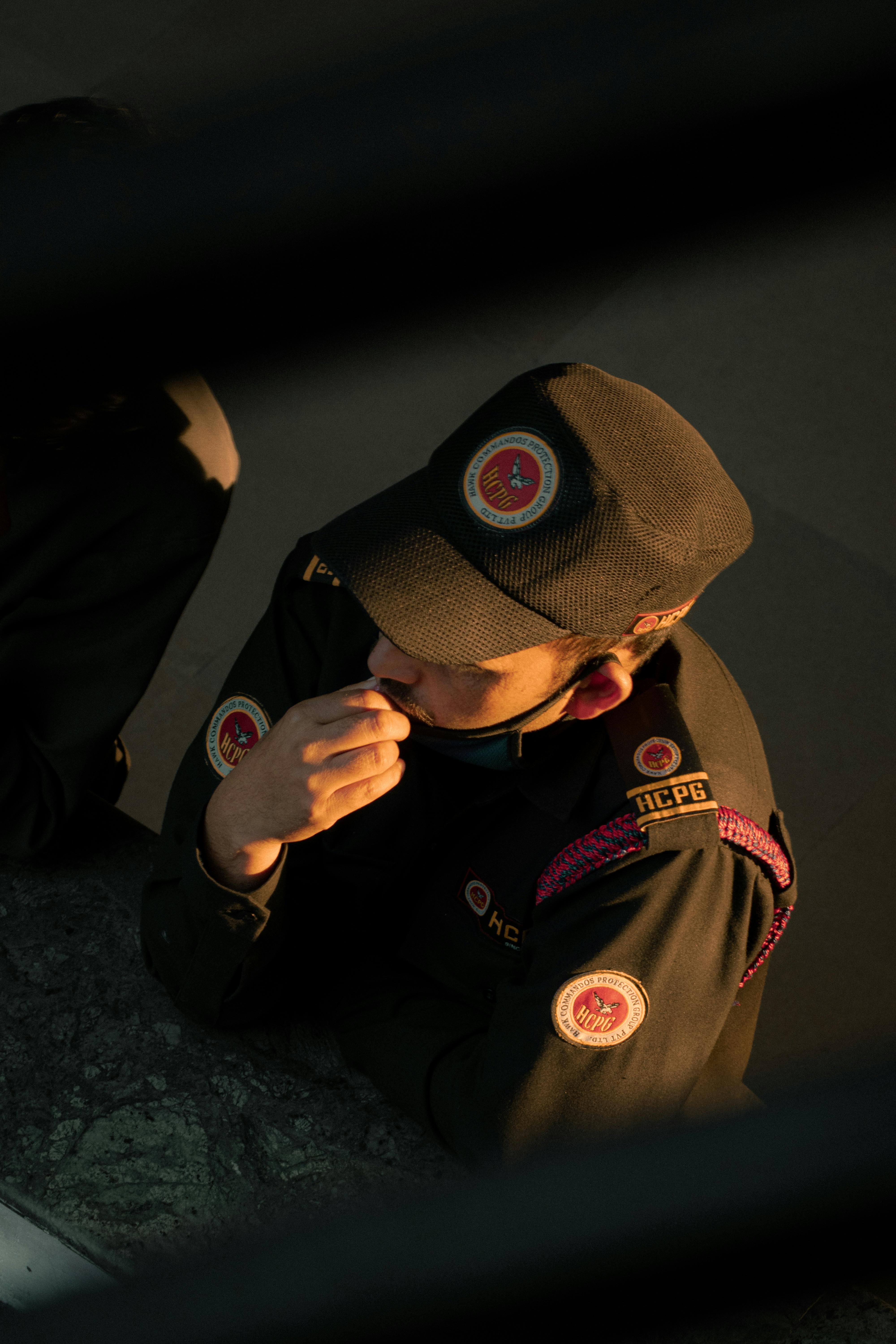 soldier wearing a cap in a shadow