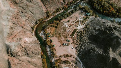 Drone Shot of a River Flowing in the Gorge of a Canyon 