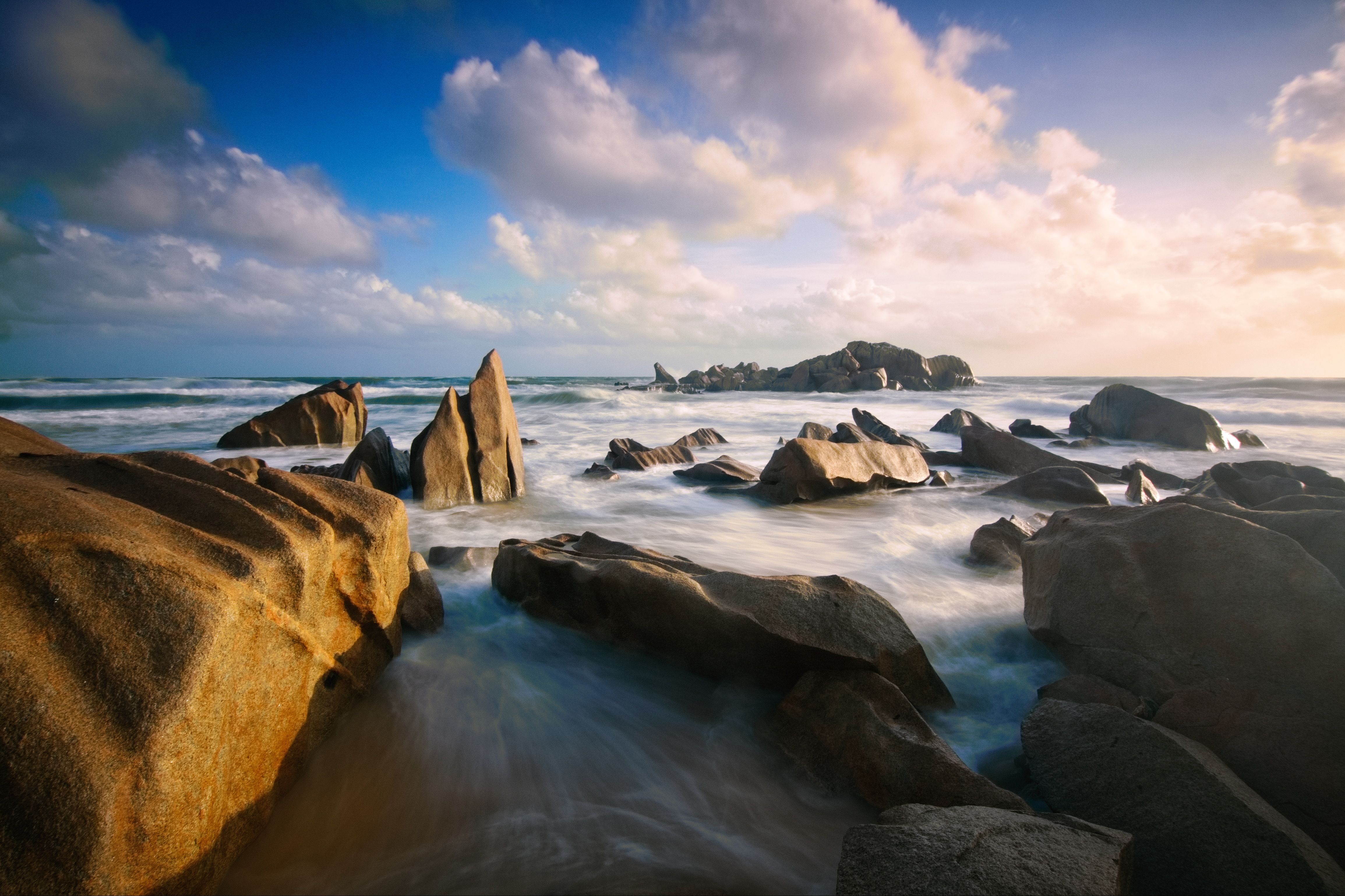 Waves between Rocks on the Shore Photographed in Long Exposure · Free ...