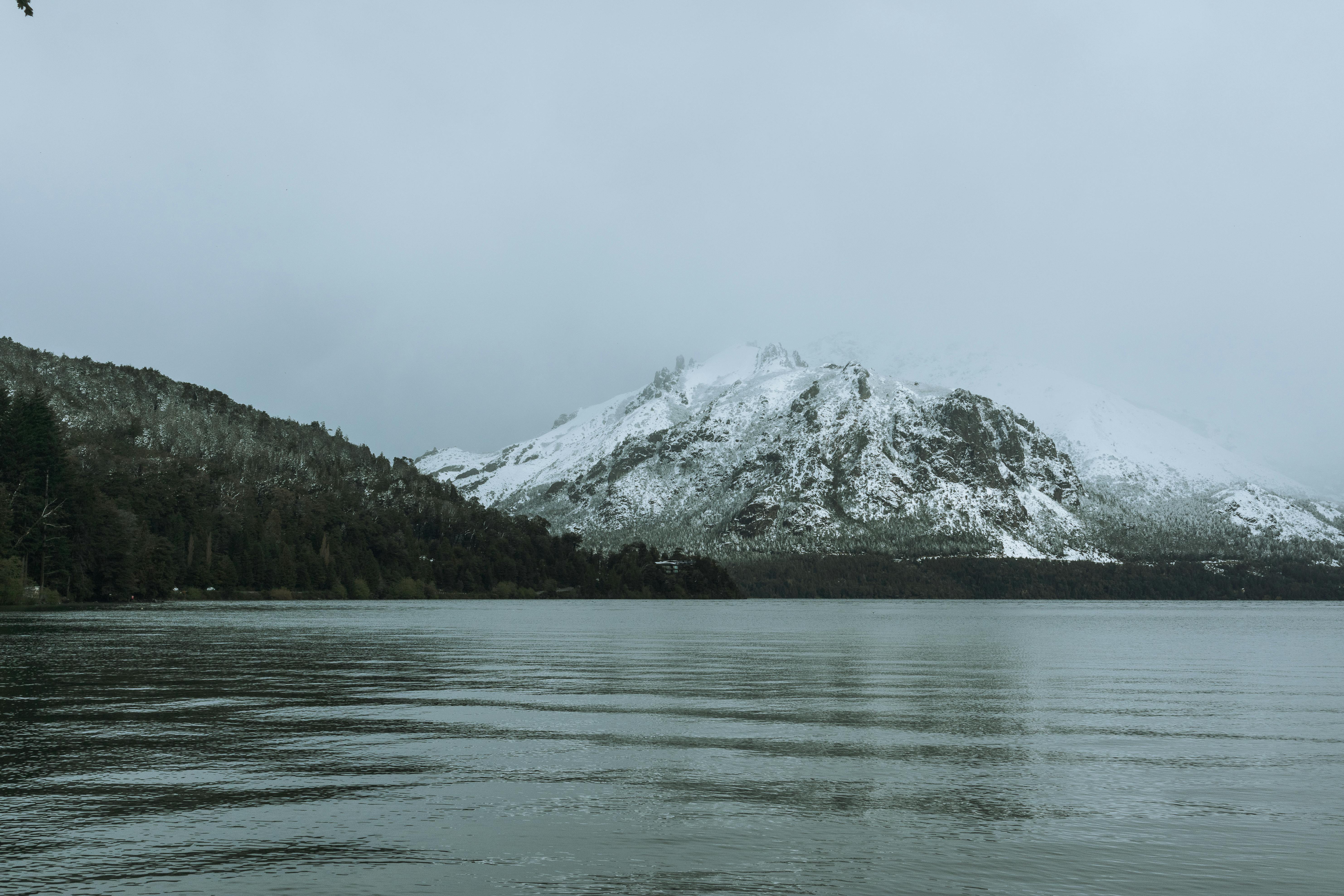 Prescription Goggle Inserts - Snow-covered mountains and a serene lake in Bariloche, Argentina create a tranquil winter scene.