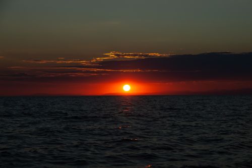 Free Beautiful sunset over the sea in Umag, Croatia, capturing vivid colors and serene horizon. Stock Photo