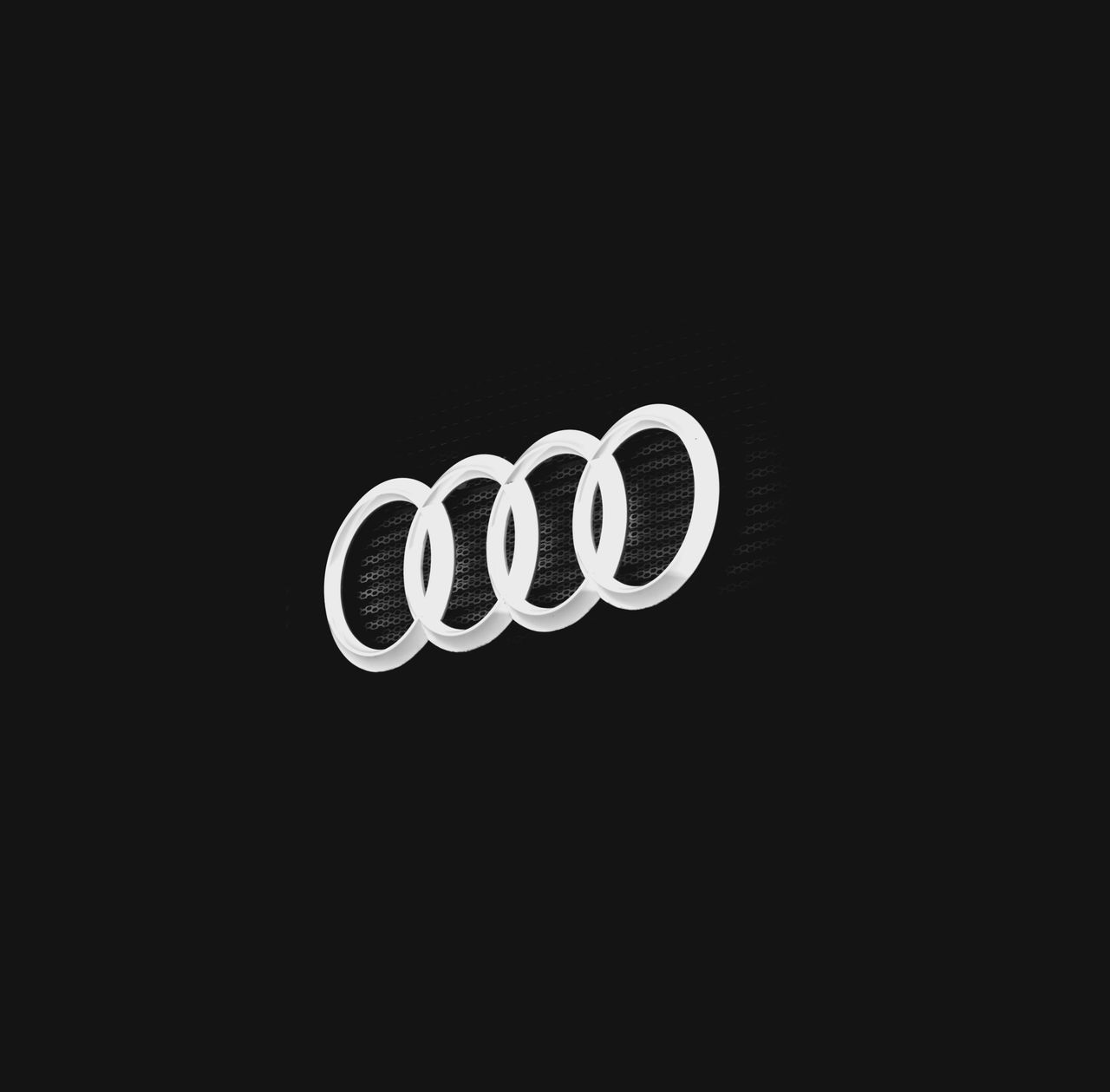 close up of a car emblem on a dark background showcasing minimal desig