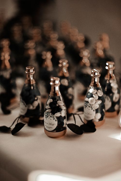 Free A collection of elegant miniature bottles beautifully arranged on a table, perfect for events. Stock Photo