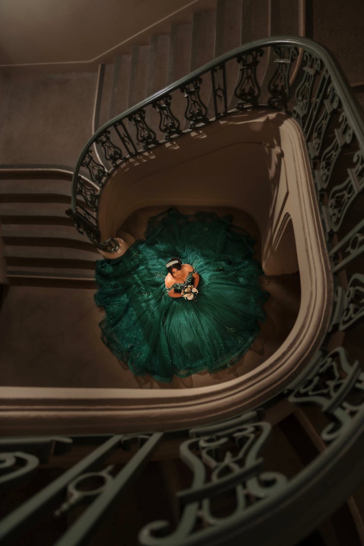 Woman Standing At The Bottom Of The Stairs 