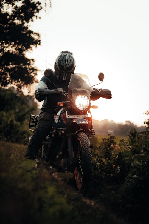 Man Riding a Motorcycle at Dusk 