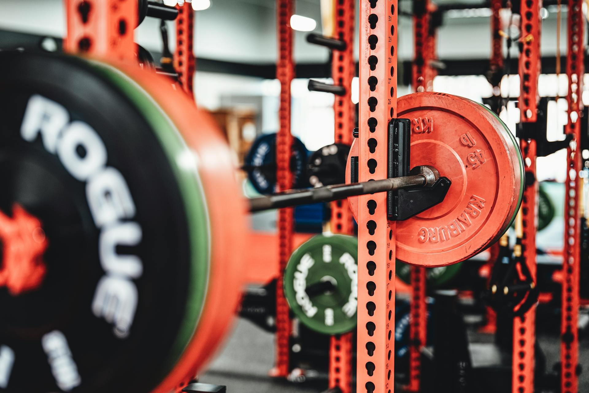 A barbell and weights in a gym