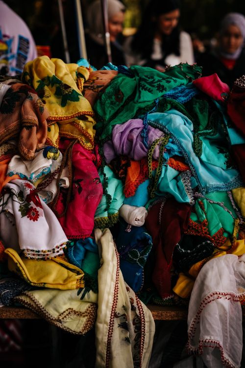 Free Vibrant assortment of scarves displayed at a market stall in Ankara, Türkiye. Stock Photo