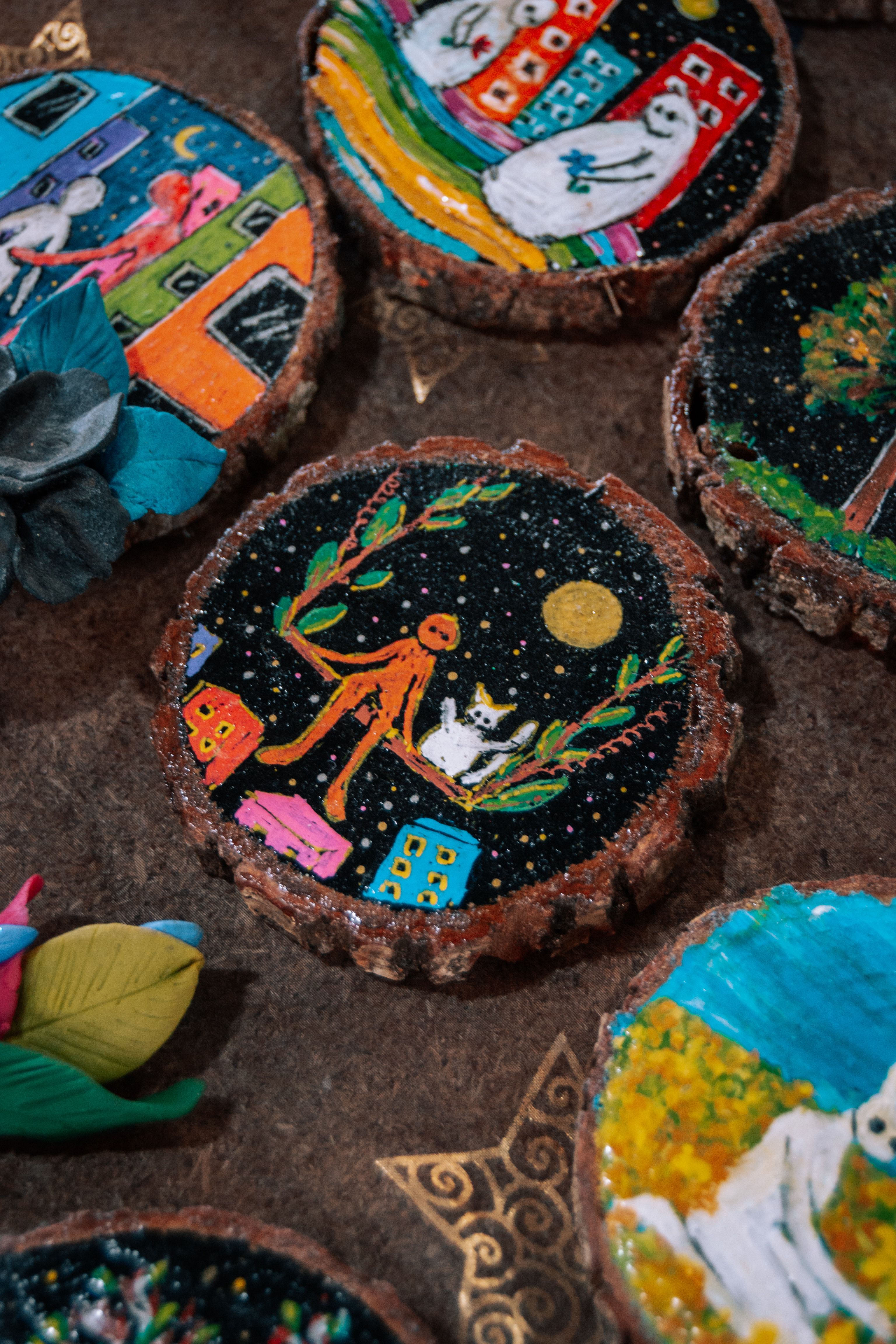 Unique handmade wooden coasters with vibrant painted designs