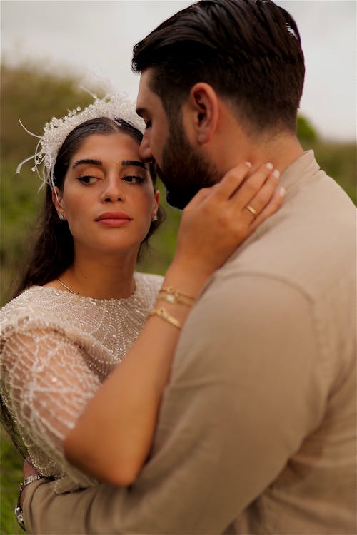 Newlywed Couple Standing and Embracing 