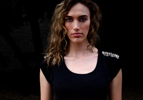 Photo of a Young Woman in a Black T-shirt 