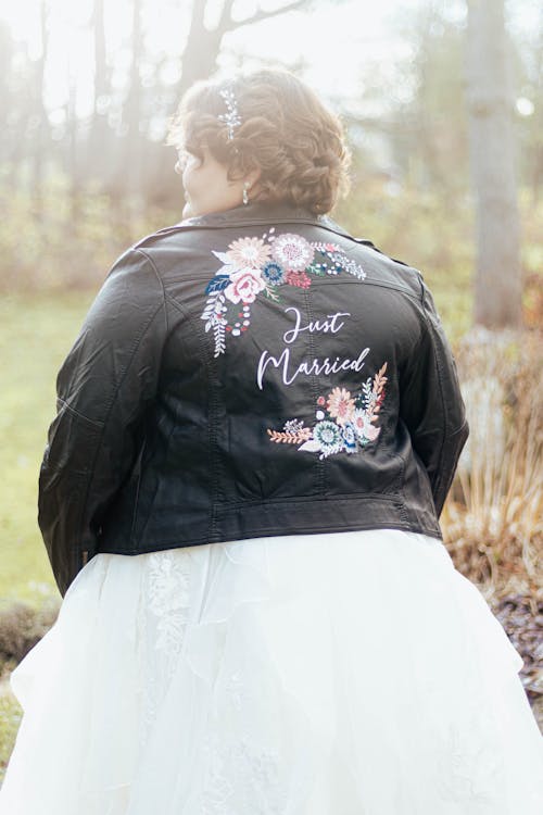 Bride in a Black Leather Jacket with Just Married Written on it 