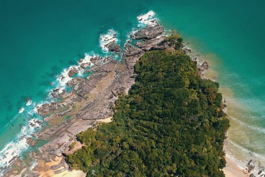 A breathtaking aerial shot of Kuala Dungun's rocky coastline and lush greenery in Malaysia.