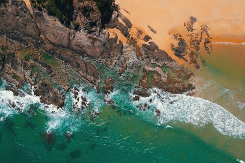 Free Discover the vibrant coastline of Kuala Dungun, Malaysia from above, showcasing its captivating natural beauty. Stock Photo