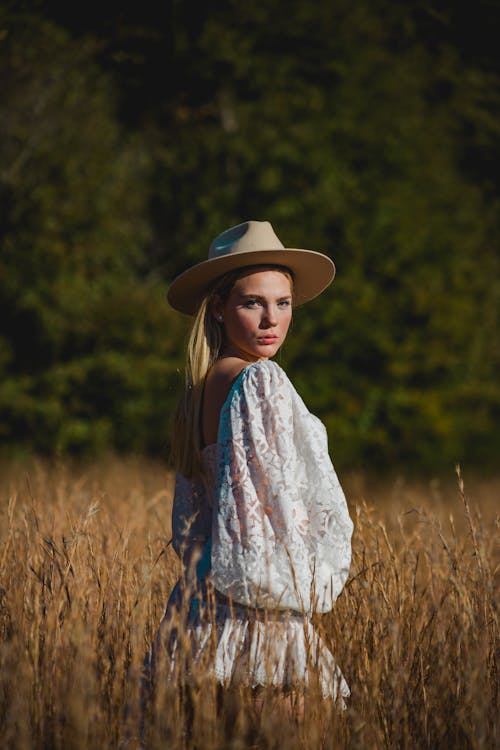 Woman in Hat on Grassland