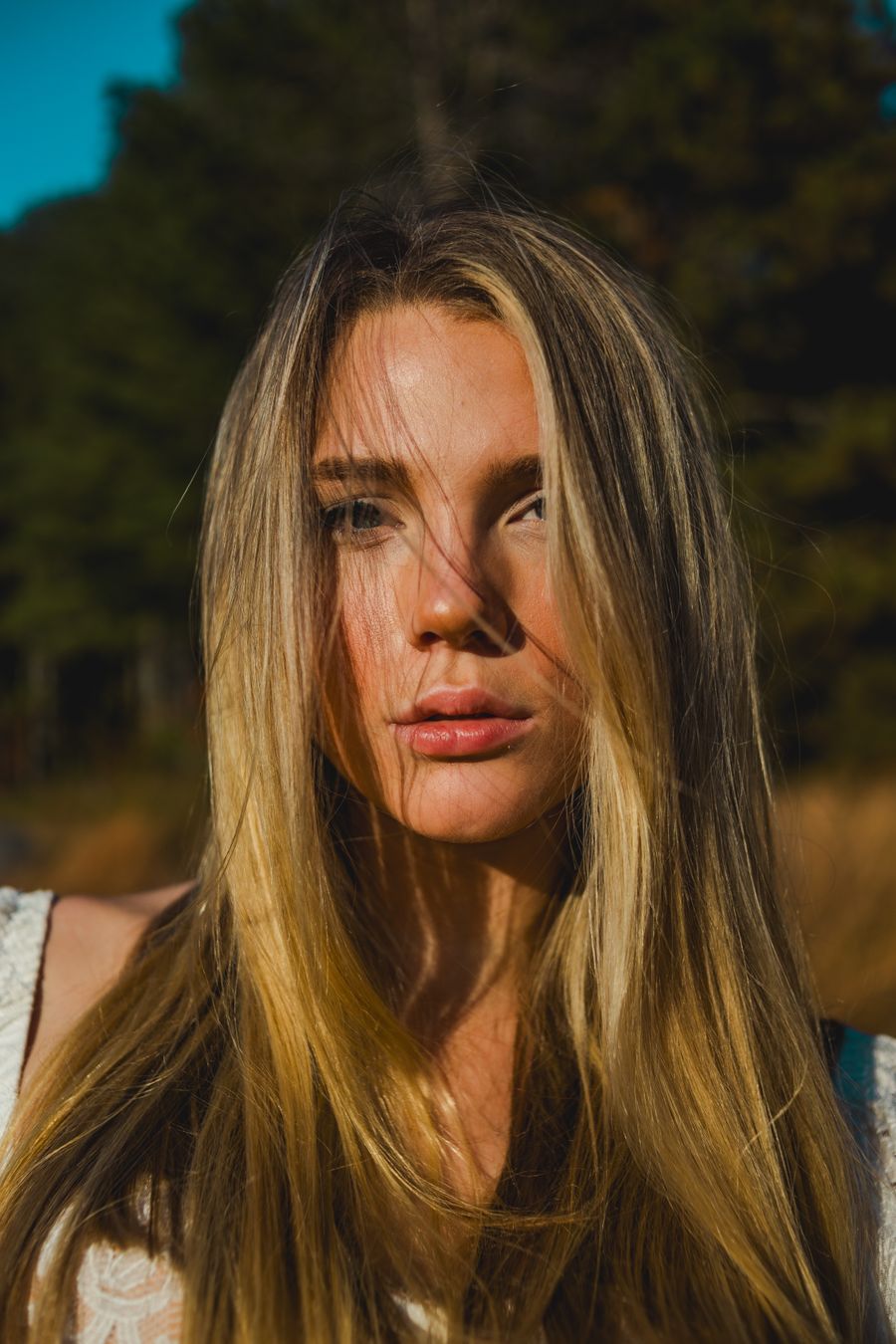 Close portrait of a woman outdoors in bright natural light — photo by Jordy Toscano on Pexels