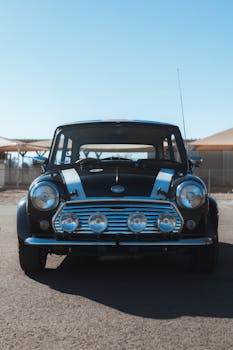 Classic Mini Cooper parked outdoors, perfect for automotive enthusiasts or vintage car fans.