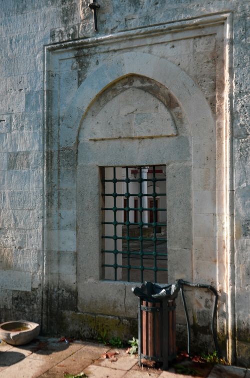 Free Barred window on an antique stone facade showcasing historical architecture. Stock Photo