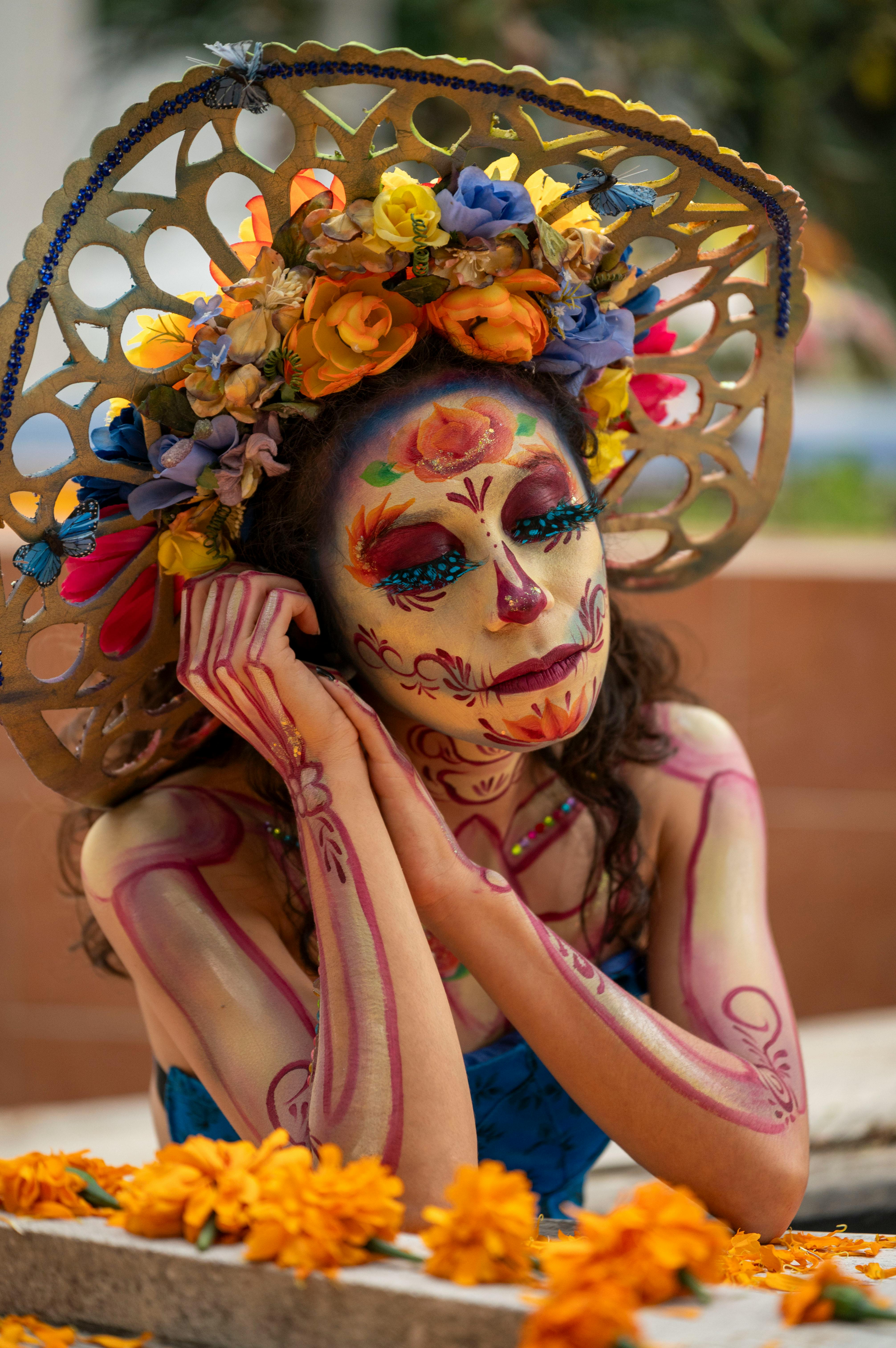 woman in traditional makeup and a headpiece posing