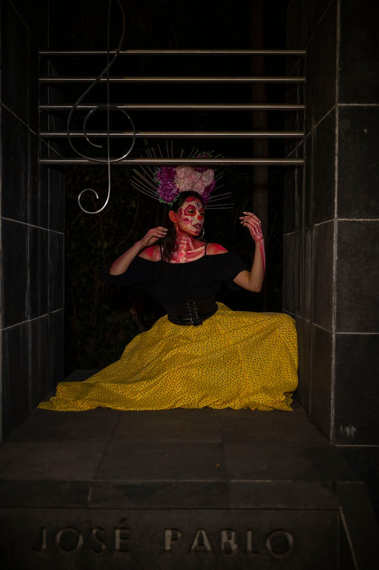 Woman In Catrina Makeup And Costume