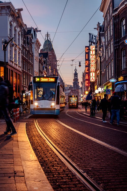 Tram is Running in Paving Street at Night