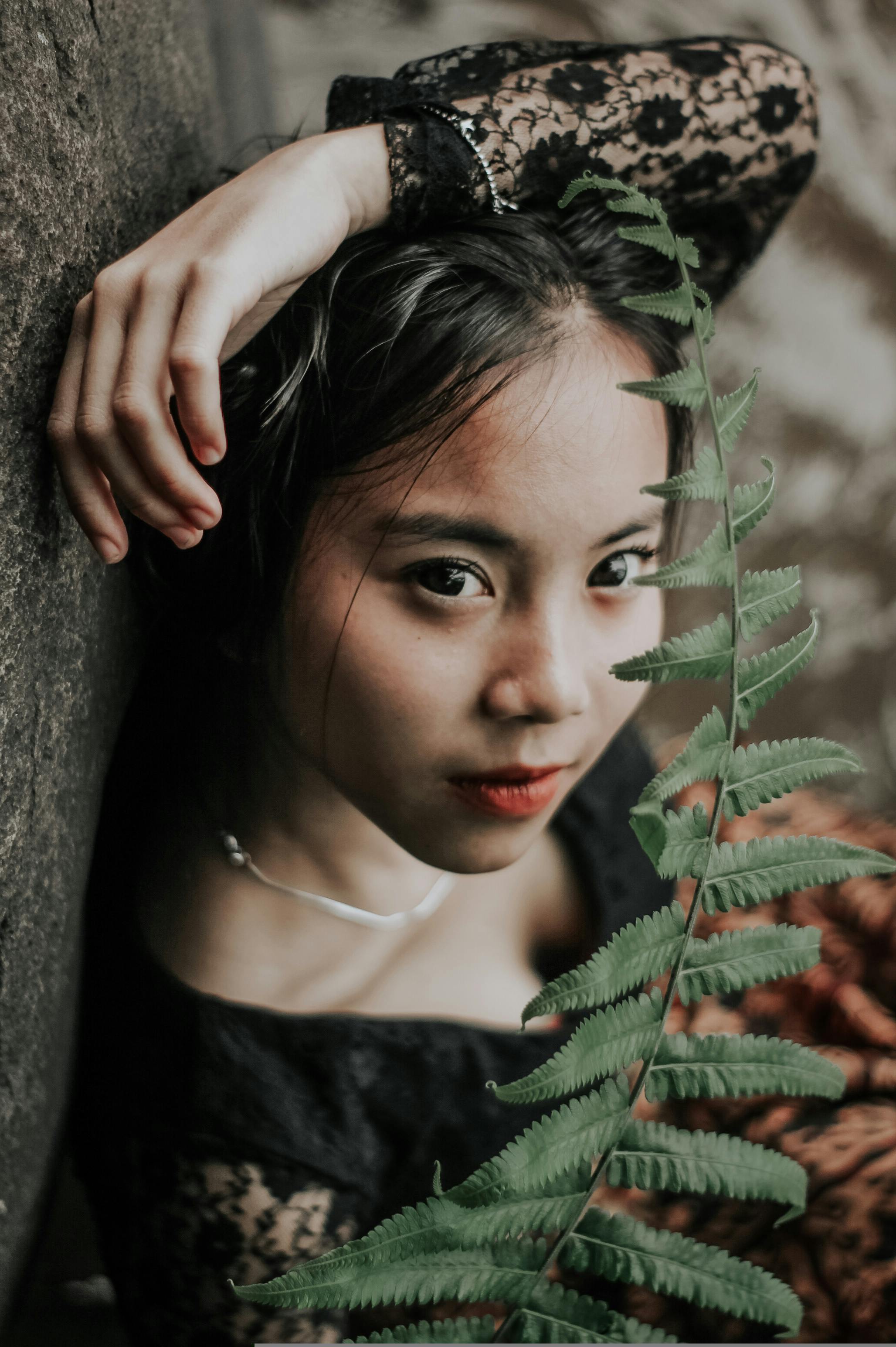 Young Woman with Fern Leaf · Free Stock Photo