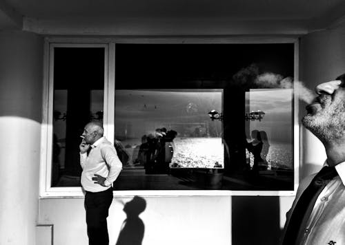 Men Smoking Cigarettes in Black and White