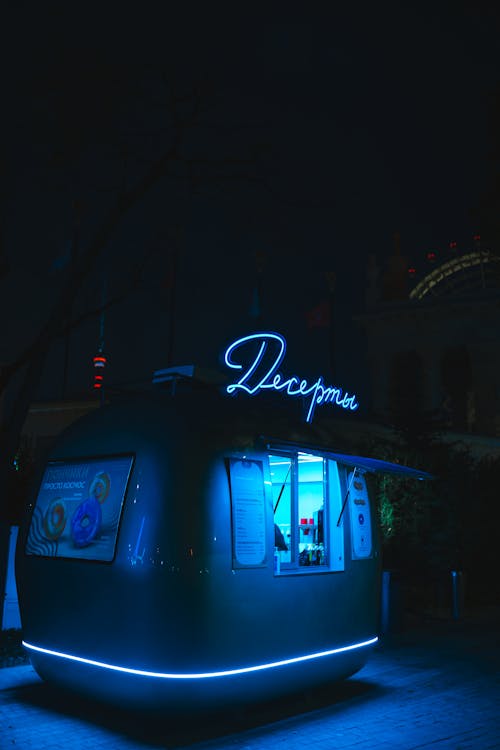 Neon Lit Food Truck Selling Donuts 