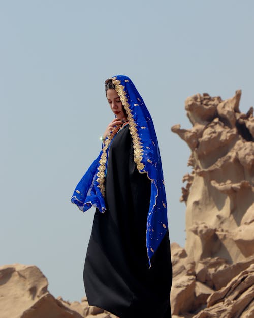 Woman in Traditional Dress and Veil