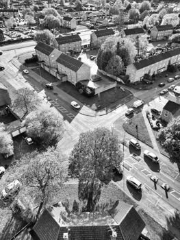 Black and white aerial photo of a residential district in Hertfordshire, England showcasing streets and houses.