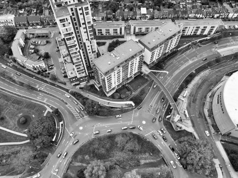 Monochrome aerial view of Hertfordshire cityscape with buildings and traffic.
