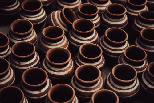 Free Close-up of handmade terracotta pots showcasing traditional craftsmanship with intricate patterns. Stock Photo