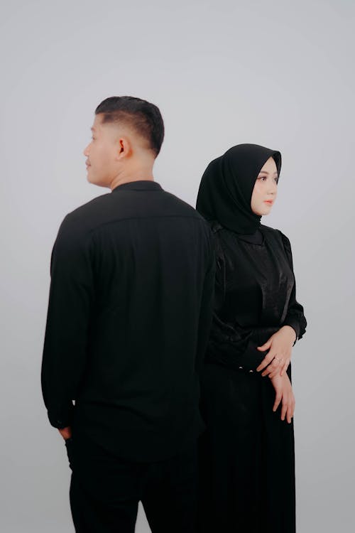 Couple in Black Clothes and Hijab