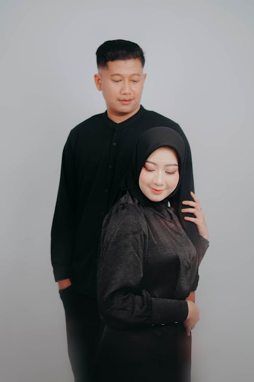 Portrait of Couple in Hijab and Black Clothes