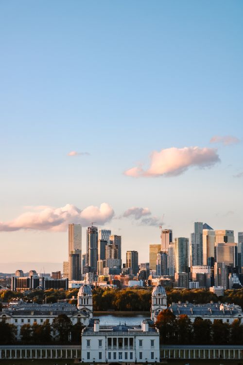Free A breathtaking aerial view of a modern city skyline with skyscrapers during sunset. Stock Photo