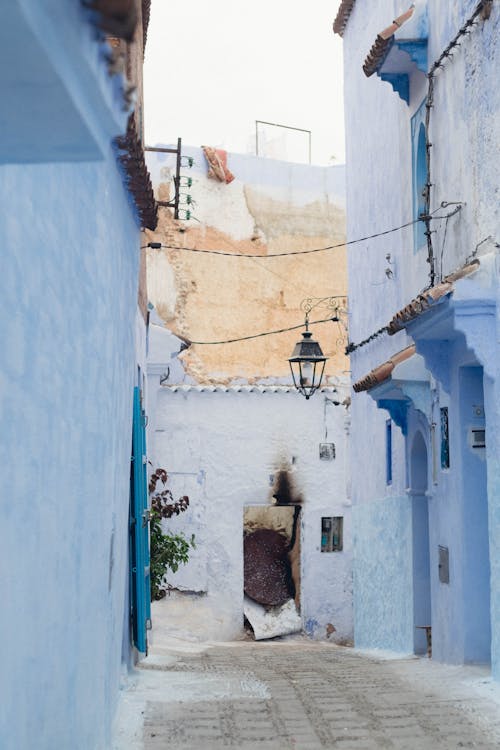 Alley between Buildings with Blue Exteriors 