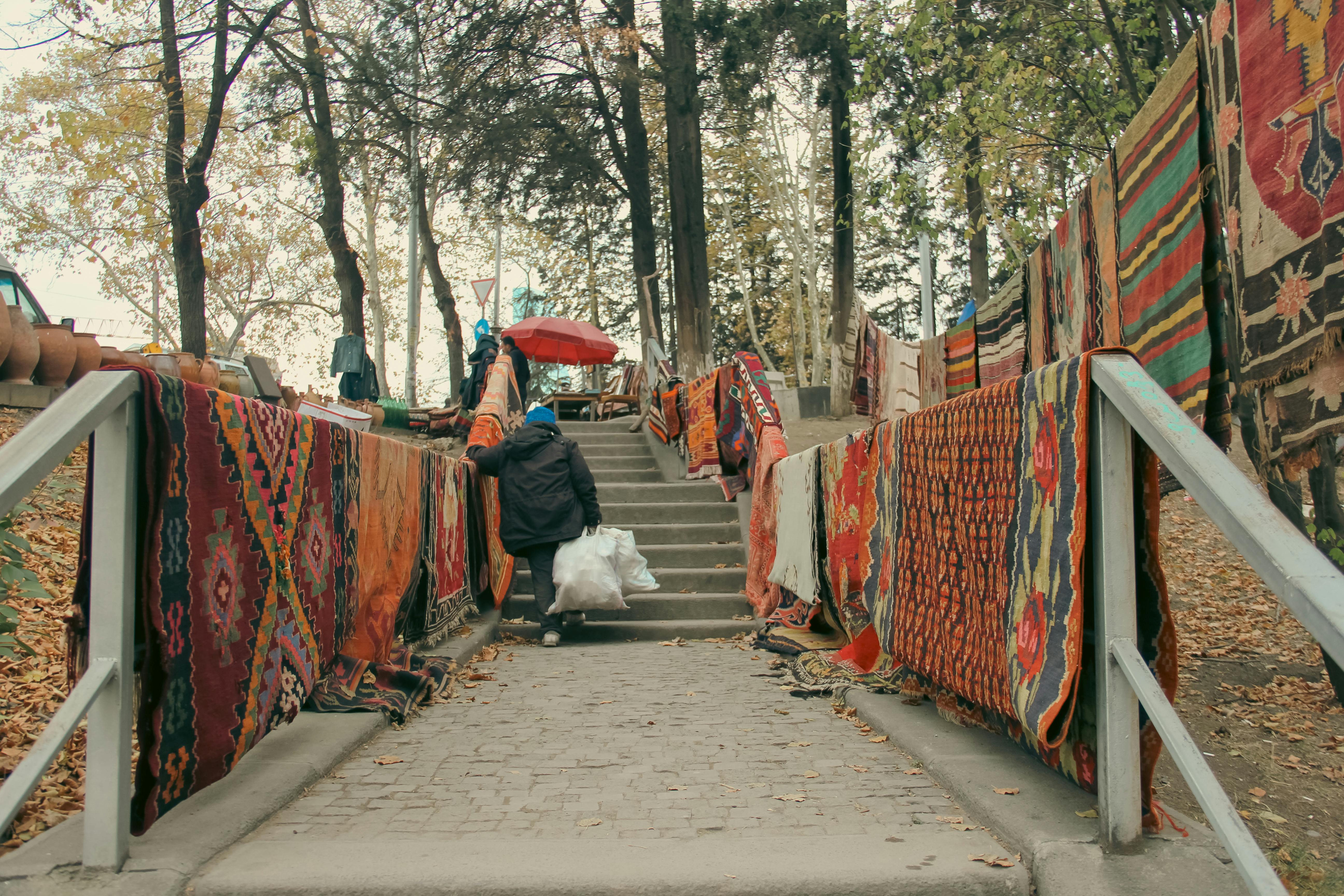 Street food vendor in Tbilisi selling churchkhela and fresh bread