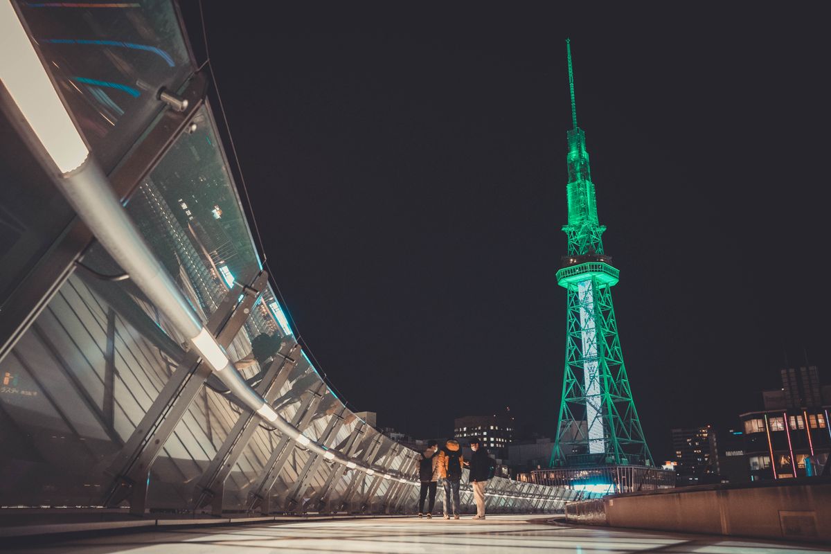 Nagoya Mirai Tower (formerly Nagoya TV Tower) illuminated in green at night — the Sakae entertainment district