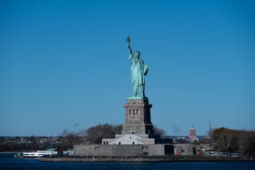 Free Stunning view of the iconic Statue of Liberty against a clear blue sky in New York City. Stock Photo