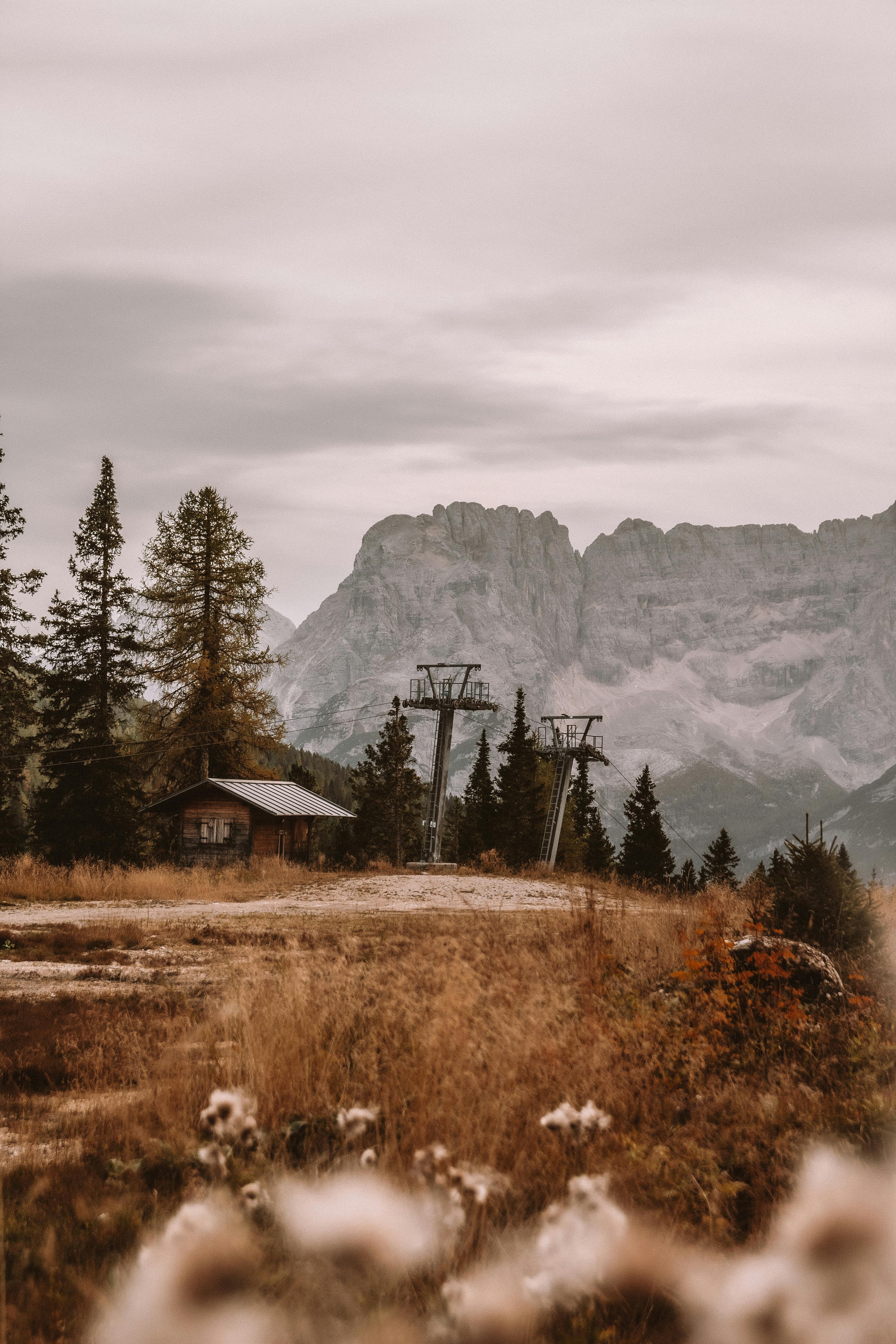 Prescription Goggle Inserts - Serene cabin and ski lift in Trentino mountains during fall, surrounded by nature.