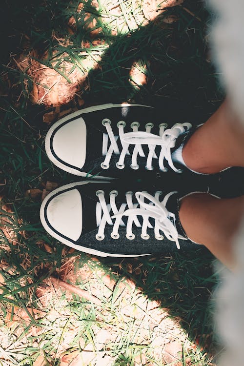 Free Person Wearing Black-and-white Low-top Sneakers Stock Photo