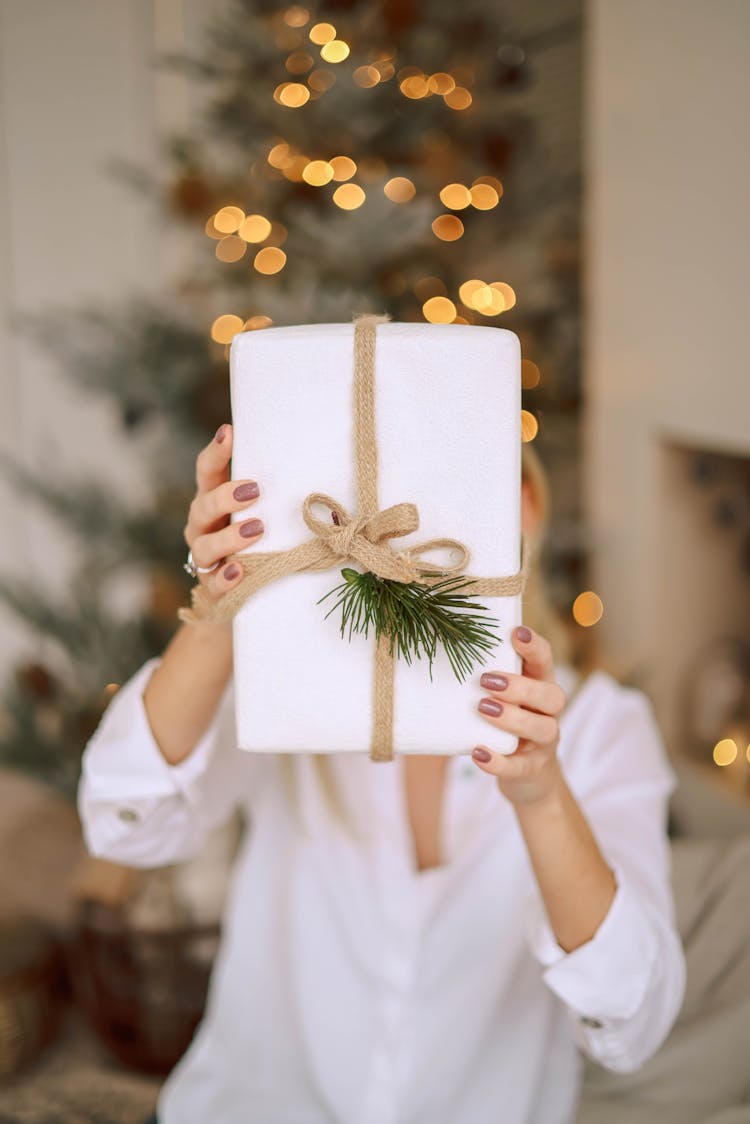 Woman Holding Christmas Present