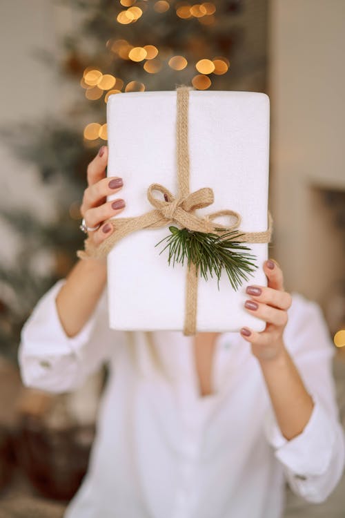 Woman Holding a Christmas Present 