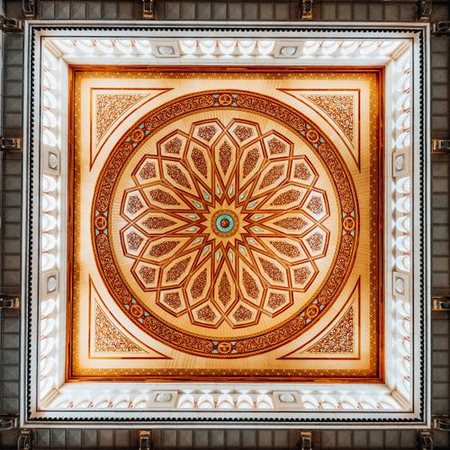 Free Ornate geometric design on a mosque ceiling showcasing Islamic art patterns. Stock Photo